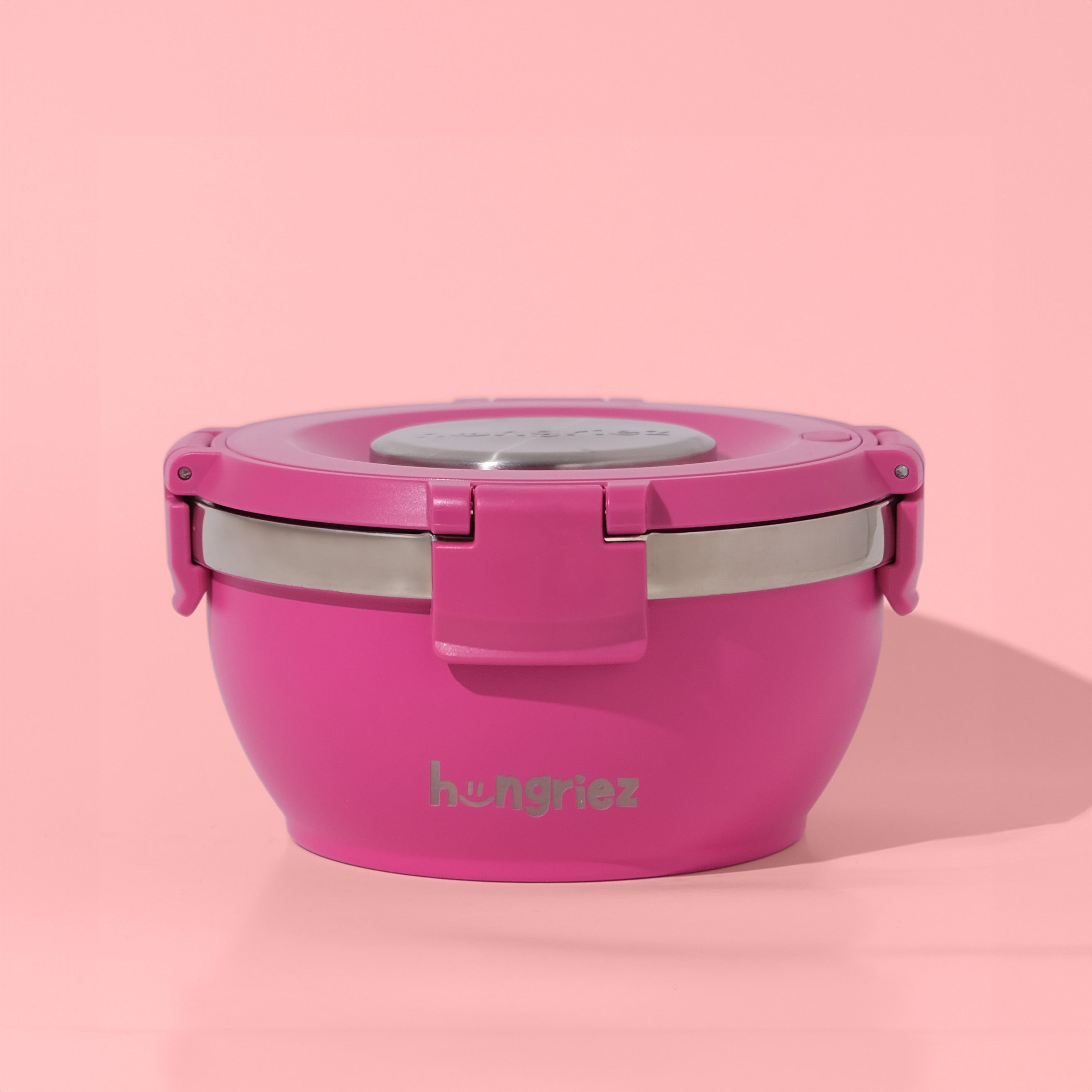 Pink lunch wide mouth thermos with a silver lid on a pink background