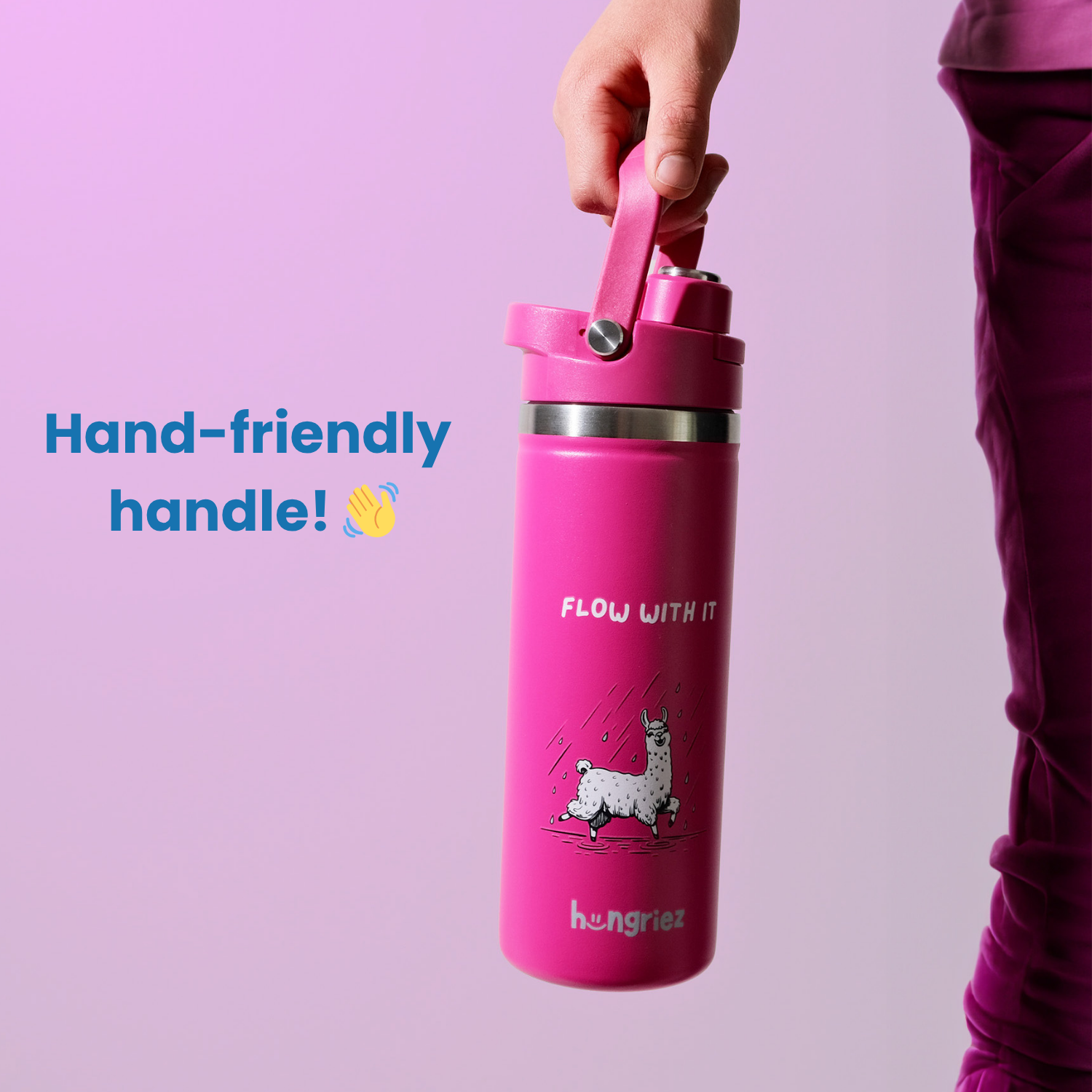 Pink water bottle with a hand-friendly handle on a purple background