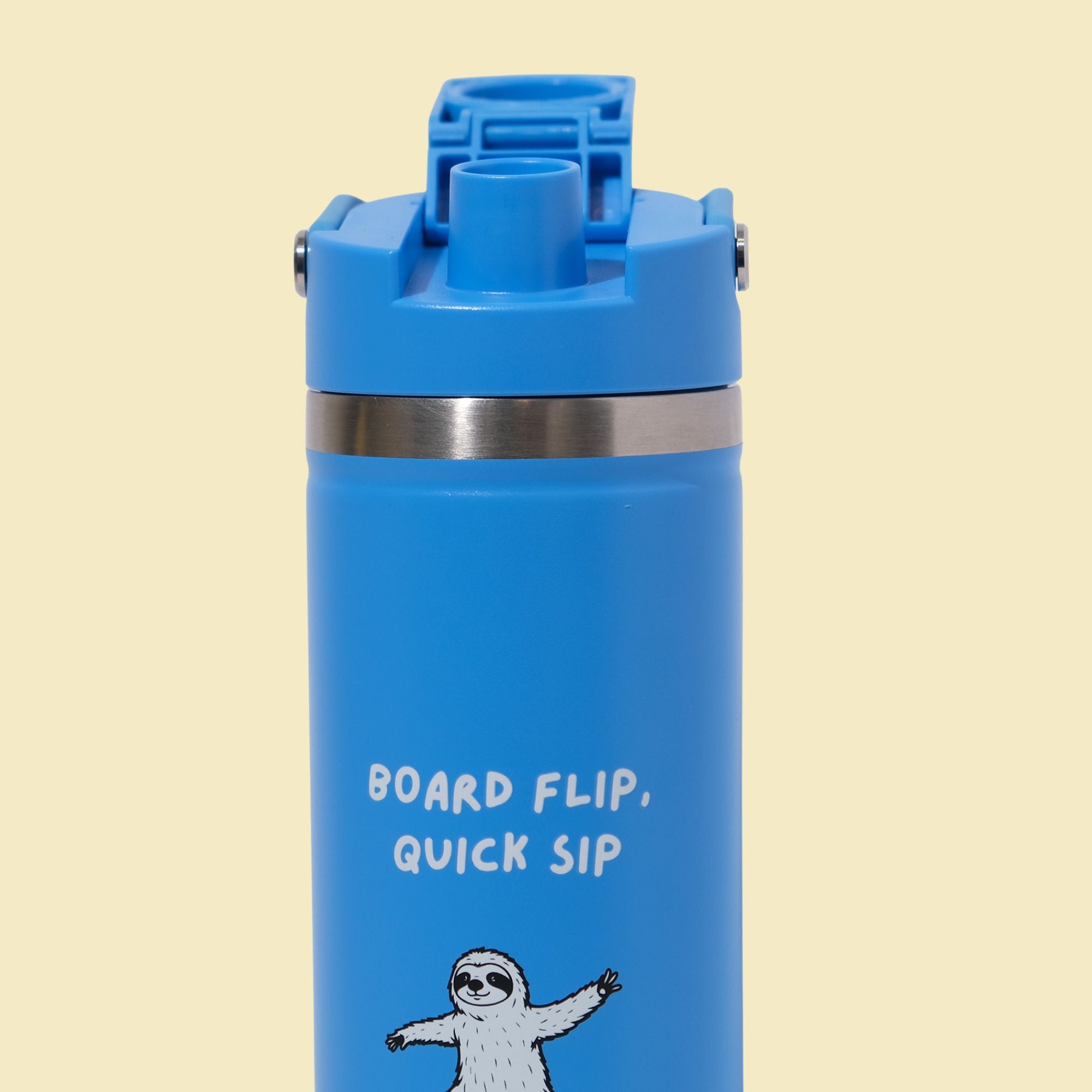 Blue water bottle with a sloth illustration and text on a beige background