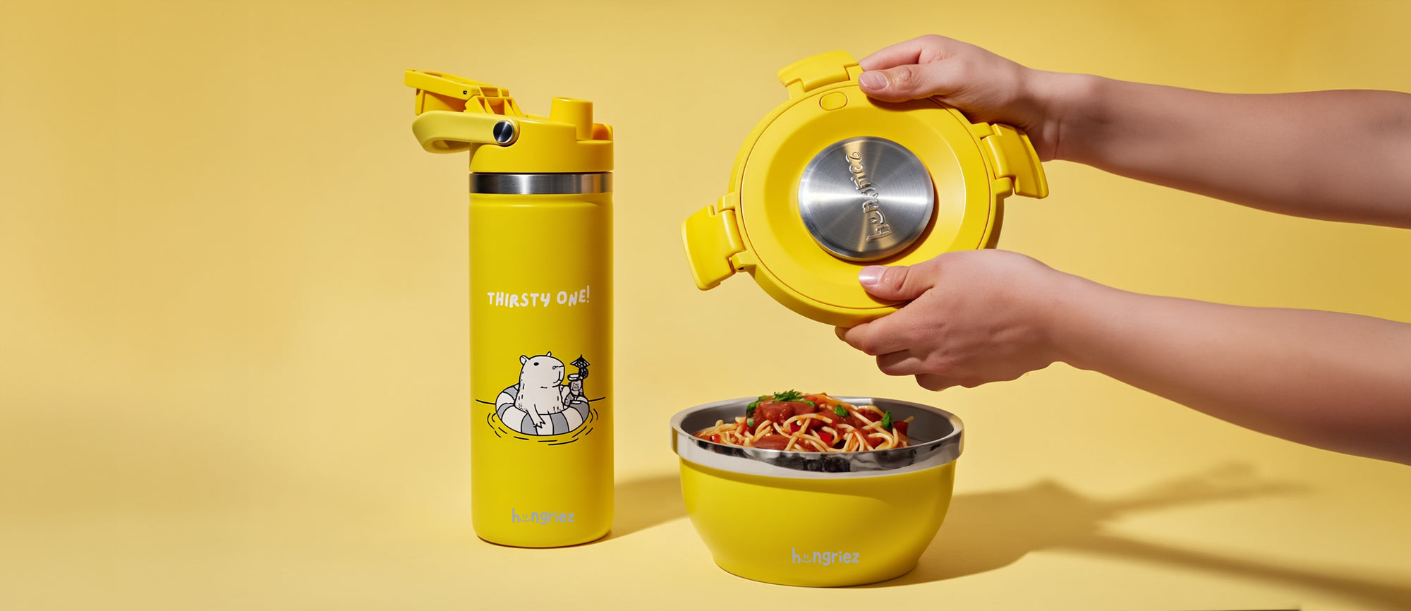 Yellow hungriez water bottle and bowl set with a cartoon character on a yellow background