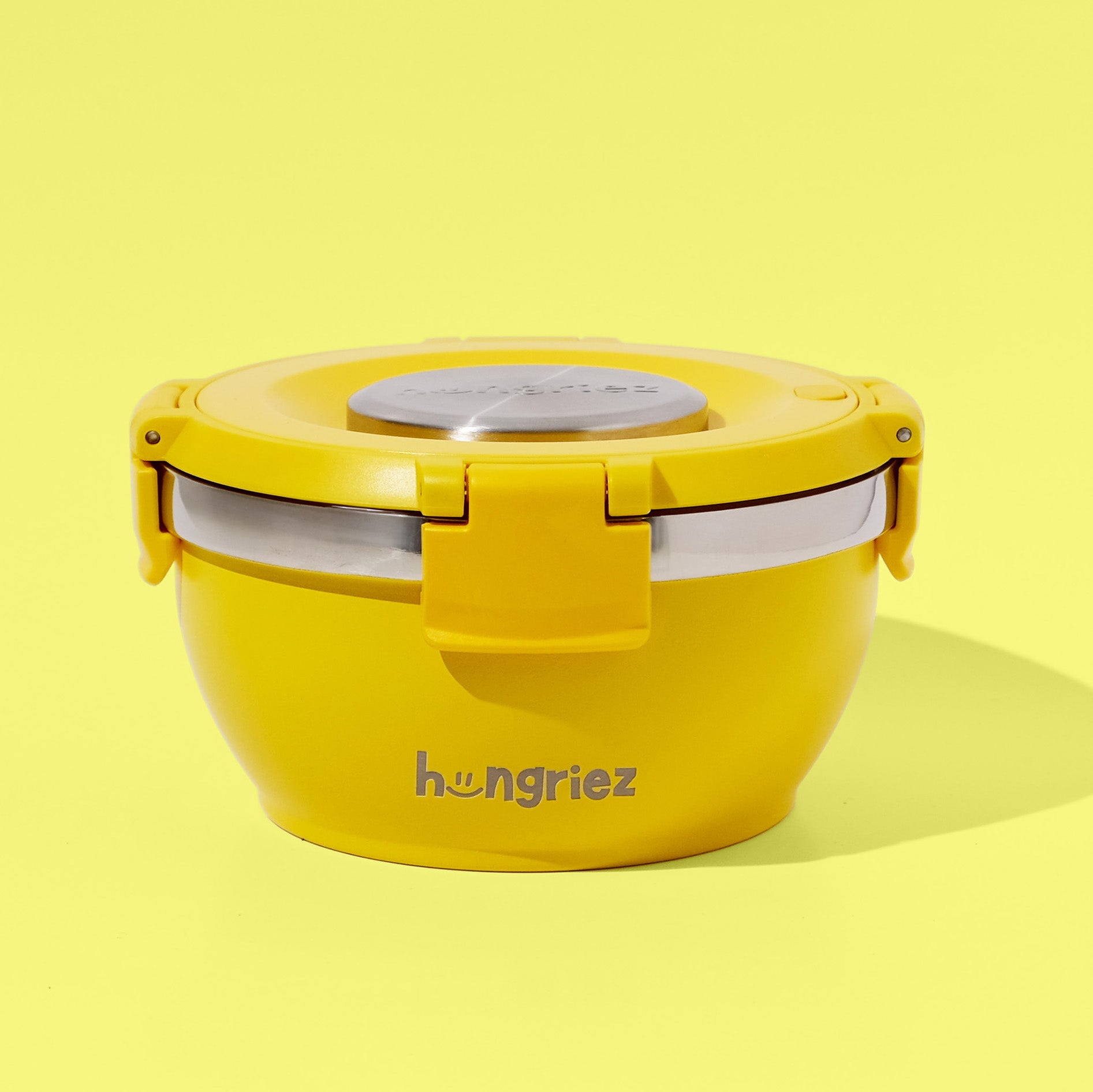 Yellow hungriez lunch thermos with a silver lid on a yellow background